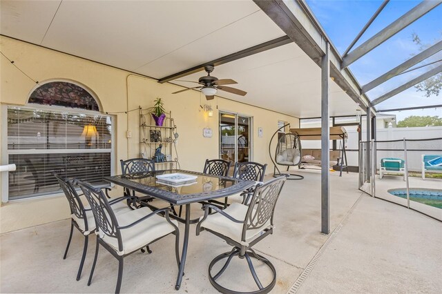 10311 Frog Pond Dr, Riverview, FL 33569 - view of patio / terrace featuring ceiling fan, outdoor dining area, and a lanai