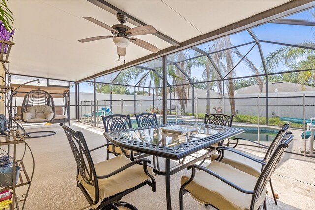10311 Frog Pond Dr, Riverview, FL 33569 - fenced backyard with a patio, a ceiling fan, outdoor dining area, and glass enclosure