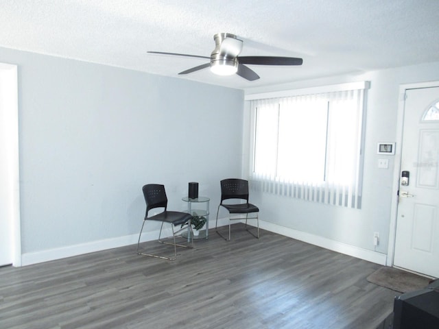 8996 Southern Comfort Dr, Largo, FL 33773 - sitting room featuring ceiling fan, a textured ceiling, wood finished floors, and baseboards