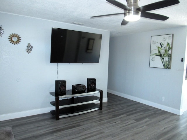 8996 Southern Comfort Dr, Largo, FL 33773 - living room featuring baseboards, a textured ceiling, wood finished floors, and a ceiling fan