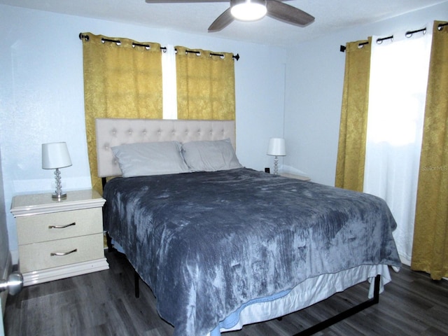 8996 Southern Comfort Dr, Largo, FL 33773 - bedroom with dark wood-style flooring and ceiling fan