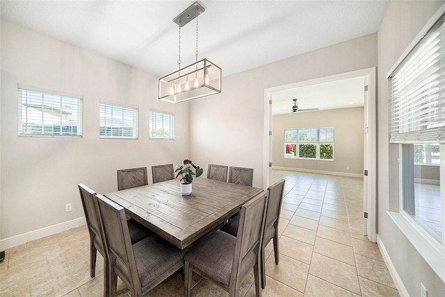 8016 Rock Spring Ct, Land O Lakes, FL 34638 - dining area featuring healthy amount of natural light, ceiling fan, light tile patterned floors, and a chandelier