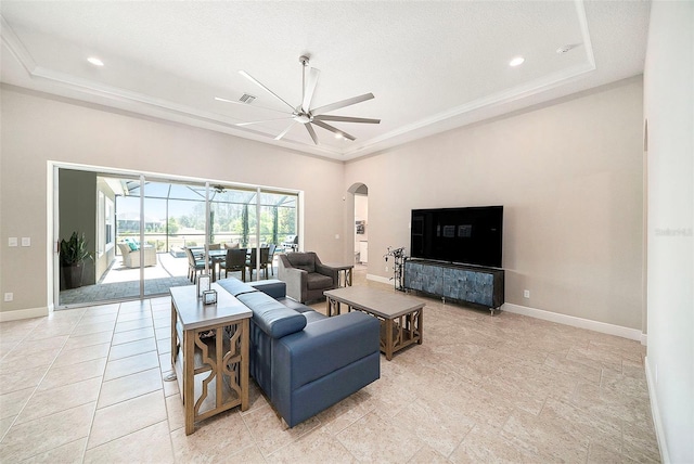 8016 Rock Spring Ct, Land O Lakes, FL 34638 - living area featuring a tray ceiling, arched walkways, ceiling fan, a sunroom, and recessed lighting