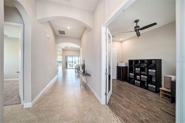 8016 Rock Spring Ct, Land O Lakes, FL 34638 - hall with baseboards and arched walkways