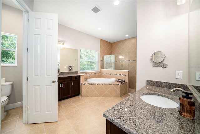 8016 Rock Spring Ct, Land O Lakes, FL 34638 - bathroom featuring tile patterned flooring, two vanities, a garden tub, recessed lighting, and walk in shower