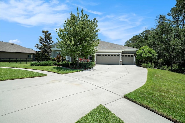 8016 Rock Spring Ct, Land O Lakes, FL 34638 - obstructed view of property featuring driveway, a garage, and a front yard