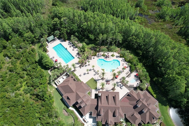 8016 Rock Spring Ct, Land O Lakes, FL 34638 - drone / aerial view of a pool area and a forest