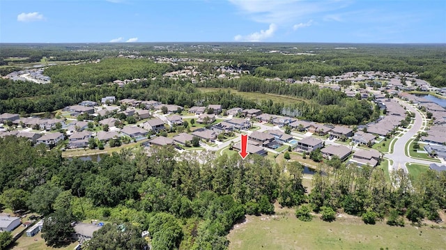 8016 Rock Spring Ct, Land O Lakes, FL 34638 - aerial view of property's location featuring nearby suburban area and a forest