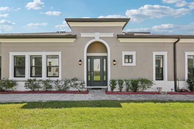 4325 Barletta Ct, Wesley Chapel, FL 33543 - property entrance with a yard and stucco siding