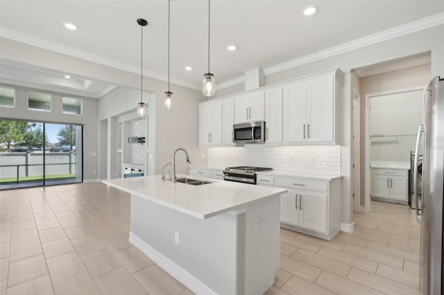 4325 Barletta Ct, Wesley Chapel, FL 33543 - kitchen featuring stainless steel appliances, a sink, tasteful backsplash, white cabinets, and light countertops
