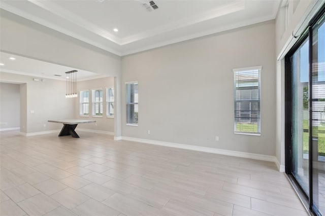 4325 Barletta Ct, Wesley Chapel, FL 33543 - unfurnished living room with ornamental molding, plenty of natural light, baseboards, a tray ceiling, and recessed lighting