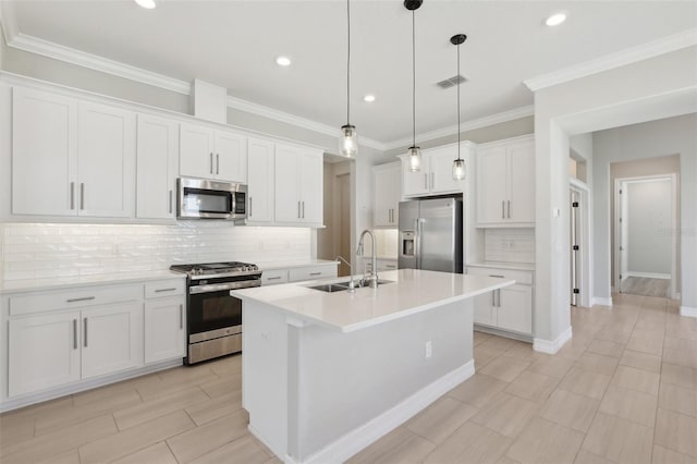 4325 Barletta Ct, Wesley Chapel, FL 33543 - kitchen featuring stainless steel appliances, a sink, tasteful backsplash, white cabinetry, and crown molding