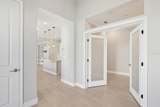 4325 Barletta Ct, Wesley Chapel, FL 33543 - corridor with baseboards, a sink, and recessed lighting