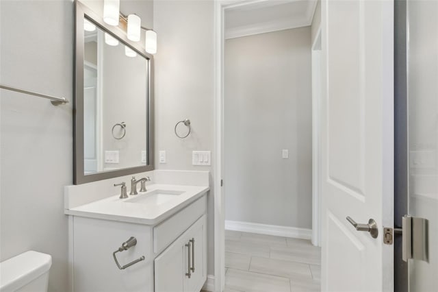 4325 Barletta Ct, Wesley Chapel, FL 33543 - bathroom featuring vanity, toilet, ornamental molding, and baseboards