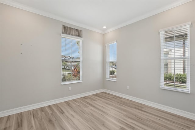 4325 Barletta Ct, Wesley Chapel, FL 33543 - empty room with light wood finished floors, healthy amount of natural light, ornamental molding, baseboards, and recessed lighting
