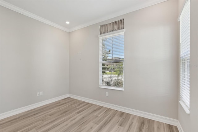 4325 Barletta Ct, Wesley Chapel, FL 33543 - empty room featuring light wood finished floors, plenty of natural light, baseboards, crown molding, and recessed lighting