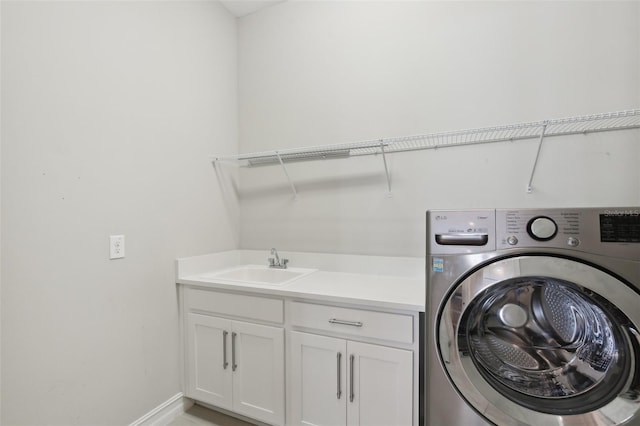 4325 Barletta Ct, Wesley Chapel, FL 33543 - laundry area featuring washer / clothes dryer, cabinet space, and baseboards