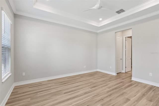 4325 Barletta Ct, Wesley Chapel, FL 33543 - unfurnished room with healthy amount of natural light, light wood finished floors, a raised ceiling, ornamental molding, and a ceiling fan
