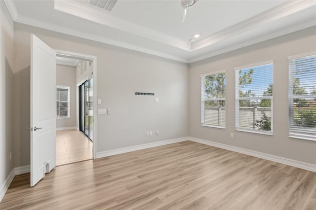 4325 Barletta Ct, Wesley Chapel, FL 33543 - unfurnished room featuring crown molding, a tray ceiling, light wood-style flooring, baseboards, and recessed lighting