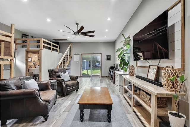 550 George St S, Tarpon Springs, FL 34688 - living room with light wood finished floors, stairs, ceiling fan, and recessed lighting