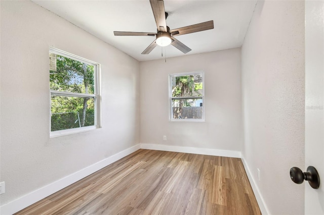1750 Dayton St S, Saint Petersburg, FL 33712 - unfurnished room with healthy amount of natural light, wood finished floors, baseboards, and ceiling fan
