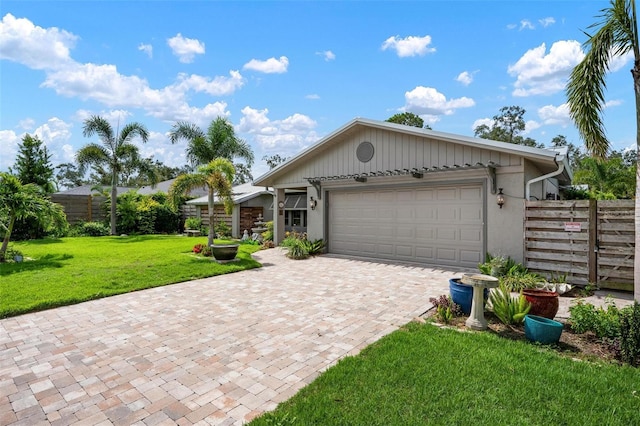 2320 James Ln, Sarasota, FL 34231 - view of front of property featuring decorative driveway, a garage, and stucco siding