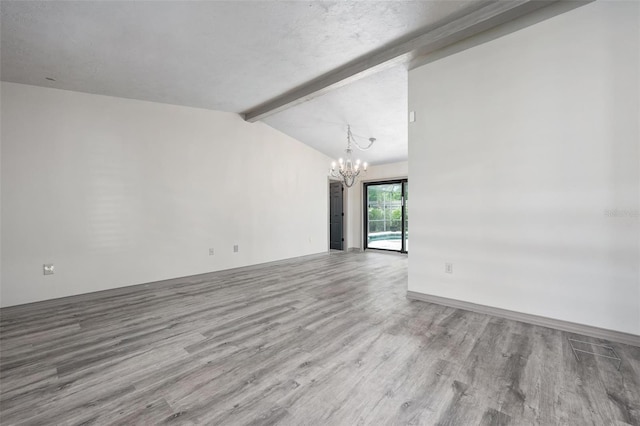 2320 James Ln, Sarasota, FL 34231 - spare room with a chandelier and wood finished floors
