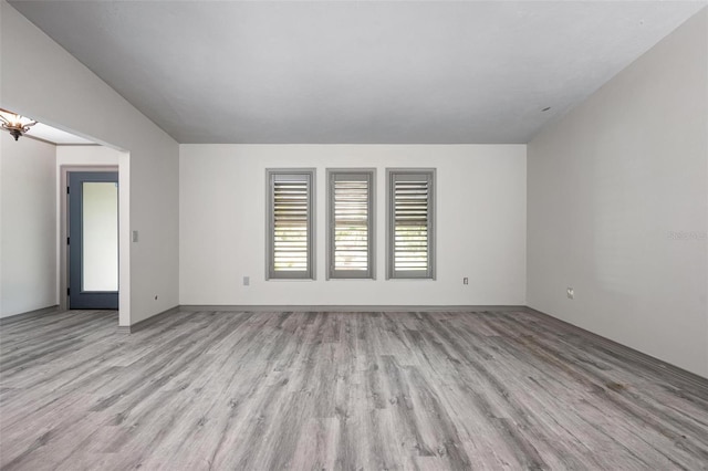 2320 James Ln, Sarasota, FL 34231 - empty room featuring light wood-style flooring and a chandelier