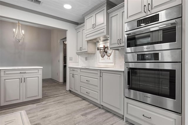 2320 James Ln, Sarasota, FL 34231 - kitchen featuring double oven, light countertops, light wood finished floors, backsplash, and recessed lighting