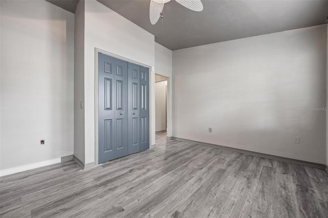 2320 James Ln, Sarasota, FL 34231 - unfurnished bedroom with wood finished floors, a closet, and ceiling fan
