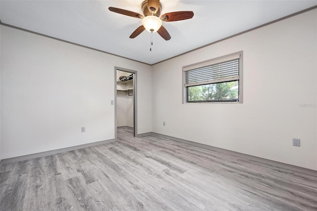 2320 James Ln, Sarasota, FL 34231 - spare room with light wood-type flooring, ornamental molding, and ceiling fan