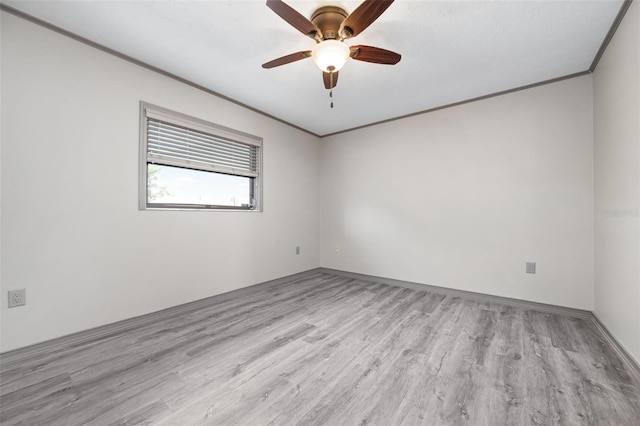 2320 James Ln, Sarasota, FL 34231 - spare room with ornamental molding, wood finished floors, and ceiling fan