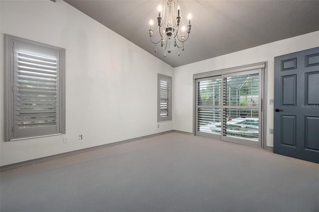 2320 James Ln, Sarasota, FL 34231 - carpeted empty room with lofted ceiling and a chandelier