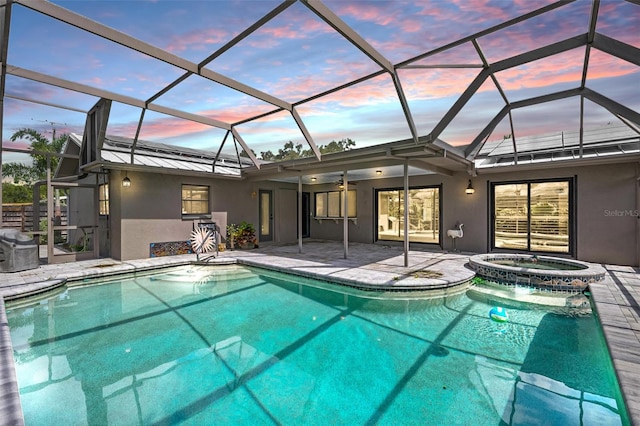 2320 James Ln, Sarasota, FL 34231 - view of pool featuring a patio area, ceiling fan, glass enclosure, and a pool with connected hot tub