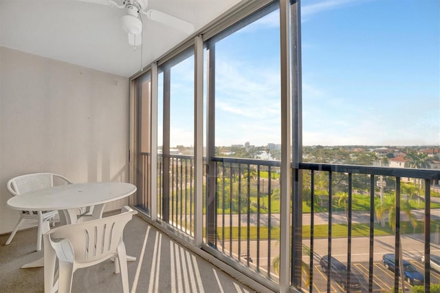 10355 Paradise Blvd Unit 502, Treasure Island, FL 33706 - sunroom with carpet flooring and a wall of windows
