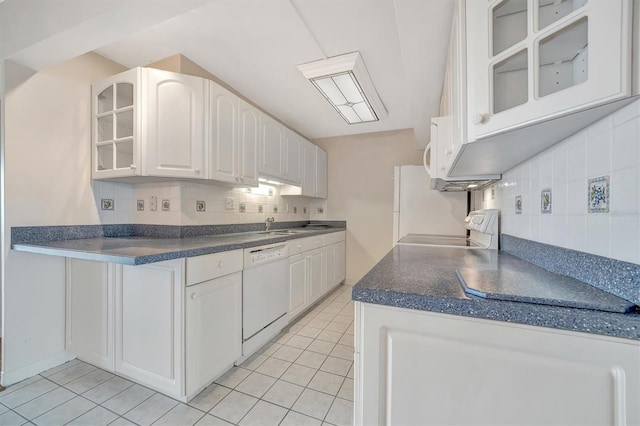 10355 Paradise Blvd Unit 502, Treasure Island, FL 33706 - kitchen featuring dishwasher, range, tasteful backsplash, and dark countertops