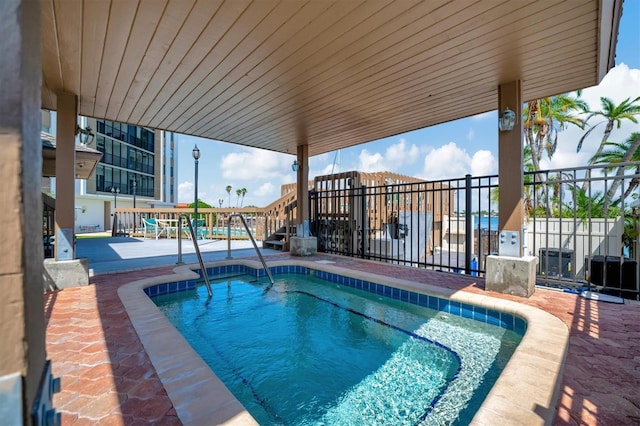 10355 Paradise Blvd Unit 502, Treasure Island, FL 33706 - view of pool with a swimming pool and a patio area