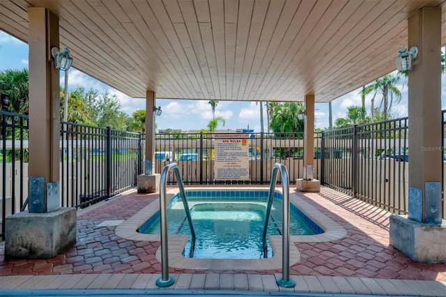 10355 Paradise Blvd Unit 502, Treasure Island, FL 33706 - view of pool with a community hot tub and a patio