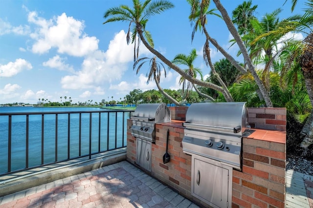 10355 Paradise Blvd Unit 502, Treasure Island, FL 33706 - view of patio / terrace featuring a water view