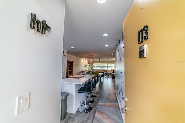 3850 13th Ave N Unit 113, Saint Petersburg, FL 33713 - hallway featuring recessed lighting, dark wood-style flooring, and baseboards
