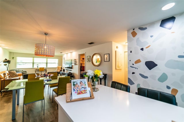 3850 13th Ave N Unit 113, Saint Petersburg, FL 33713 - dining room featuring a chandelier