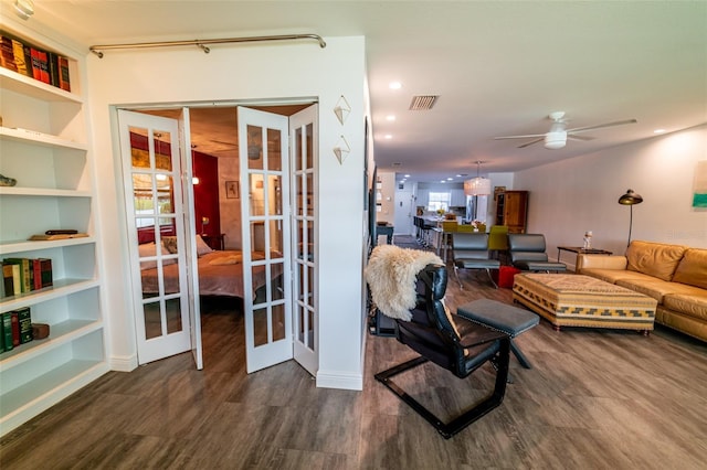 3850 13th Ave N Unit 113, Saint Petersburg, FL 33713 - living room featuring a ceiling fan, wood finished floors, and french doors