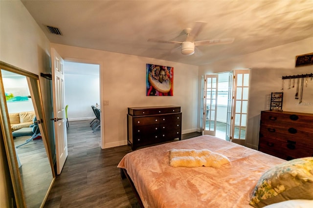 3850 13th Ave N Unit 113, Saint Petersburg, FL 33713 - bedroom featuring dark wood finished floors, baseboards, and a ceiling fan