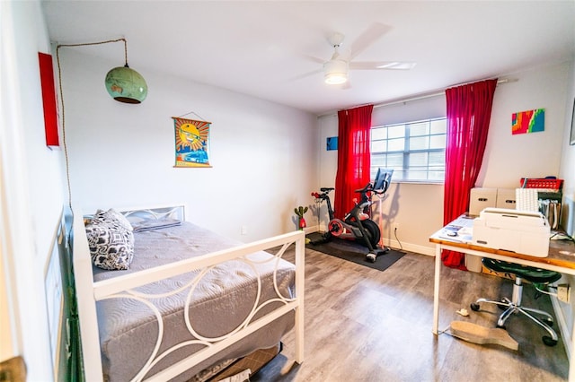 3850 13th Ave N Unit 113, Saint Petersburg, FL 33713 - bedroom with wood finished floors, baseboards, an office area, and a ceiling fan