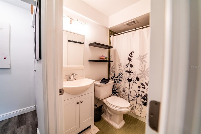 3850 13th Ave N Unit 113, Saint Petersburg, FL 33713 - bathroom featuring vanity, toilet, and a shower with curtain