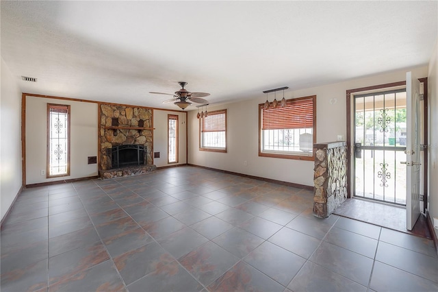 2614 E Liberty St, Tampa, FL 33612 - unfurnished living room featuring a fireplace, tile patterned floors, and ceiling fan
