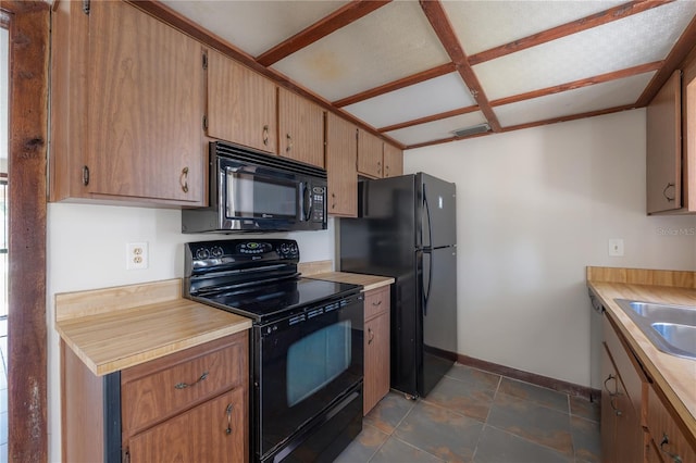 2614 E Liberty St, Tampa, FL 33612 - kitchen featuring black appliances, light countertops, and dark tile patterned flooring