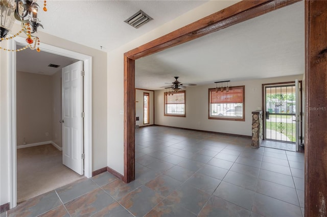 2614 E Liberty St, Tampa, FL 33612 - spare room featuring ceiling fan and tile patterned floors