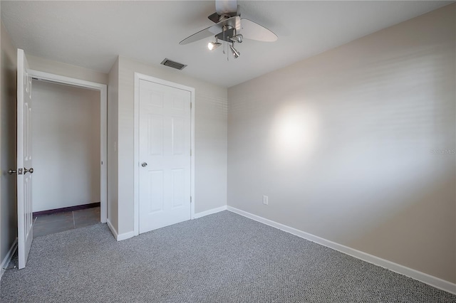 2614 E Liberty St, Tampa, FL 33612 - unfurnished bedroom with carpet floors and ceiling fan