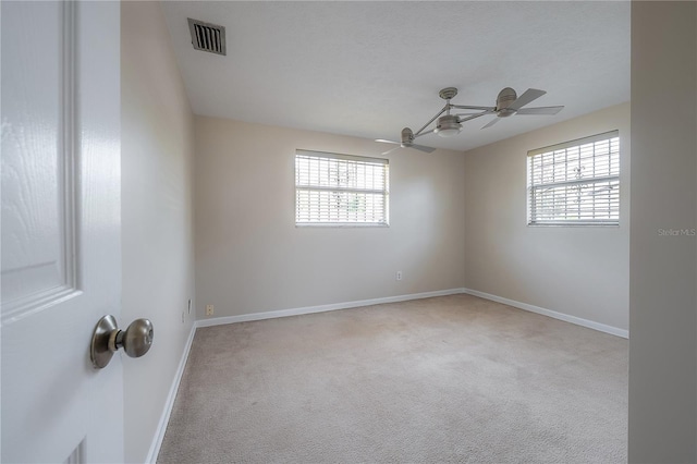 2614 E Liberty St, Tampa, FL 33612 - unfurnished room featuring carpet and a ceiling fan